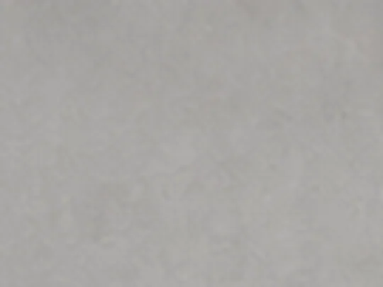 Smooth microcement wall finish in a soft grey tone
