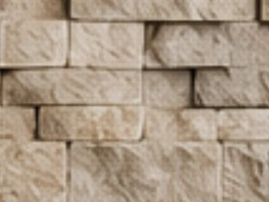 Stacked stone veneer accent wall in warm limestone tones
