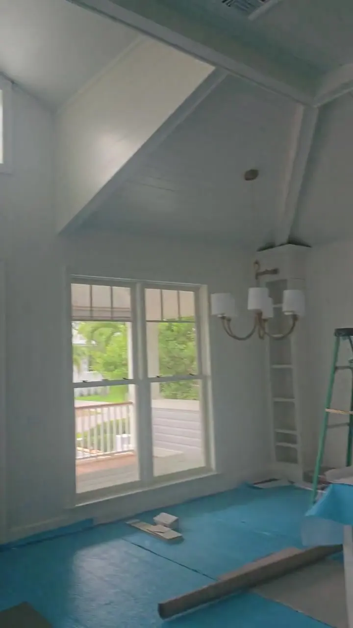 Kitchen mid-project with surfaces masked and floors fully protected before any finish is applied.