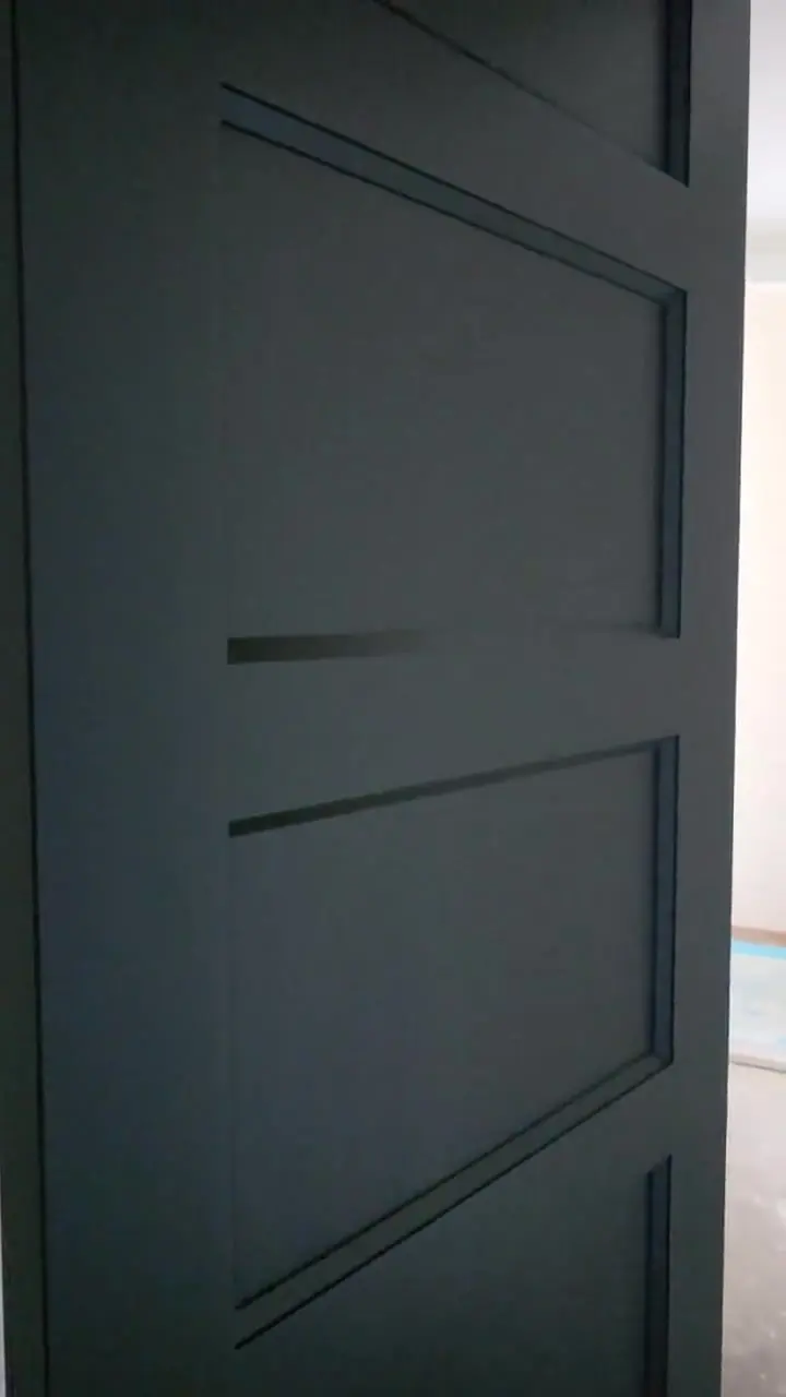 Wall with picture-frame molding installed and finished, showing the corners and mitre joints.